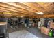 Unfinished basement with exposed ceiling, unfinished flooring, shelving, and storage at 461 Cedar Pond Ct, Knightdale, NC 27545