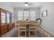 Inviting dining room featuring natural light, a ceiling fan, and elegant furniture at 461 Cedar Pond Ct, Knightdale, NC 27545