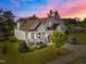 Charming two-story home featuring a covered front porch, well-maintained lawn, and beautiful landscaping at 461 Cedar Pond Ct, Knightdale, NC 27545