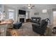 Inviting living room with fireplace, TV, and comfortable seating arrangement at 461 Cedar Pond Ct, Knightdale, NC 27545