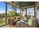 Relaxing screened porch with comfortable wicker furniture and outdoor views at 461 Cedar Pond Ct, Knightdale, NC 27545