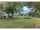 Large backyard with a trampoline, playset, and ample space for recreational activities and entertaining at 4620 Gomar Ln, Fuquay Varina, NC 27526