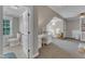 Bathroom with a view into an adjacent bedroom that features a built-in desk and bed with storage underneath at 4620 Gomar Ln, Fuquay Varina, NC 27526
