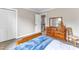Bedroom with two windows providing natural light and views, carpet flooring, and storage space at 4620 Gomar Ln, Fuquay Varina, NC 27526