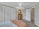 Comfortable bedroom with neutral walls, carpet flooring, windows that let in natural light, and ample storage at 4620 Gomar Ln, Fuquay Varina, NC 27526