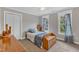 Bedroom with two windows providing natural light, carpet flooring, and storage space at 4620 Gomar Ln, Fuquay Varina, NC 27526