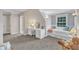 Bright bedroom features a built-in desk and bed next to a large window, and a private bathroom entrance at 4620 Gomar Ln, Fuquay Varina, NC 27526