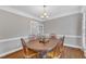Cozy dining room with chandelier and traditional finishes at 4620 Gomar Ln, Fuquay Varina, NC 27526