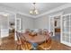 Spacious dining room with seating for six, and adjacent rooms at 4620 Gomar Ln, Fuquay Varina, NC 27526