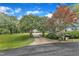 Long driveway leading to a property surrounded by lush trees and well-maintained greenery at 4620 Gomar Ln, Fuquay Varina, NC 27526