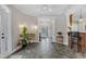 Welcoming entryway with tile flooring, view of front door, and access to kitchen at 4620 Gomar Ln, Fuquay Varina, NC 27526