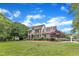 Spacious brick home with meticulously landscaped yard, showcasing classic design and curb appeal at 4620 Gomar Ln, Fuquay Varina, NC 27526