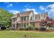 Stately brick home boasting classic architecture,dormer windows and manicured landscaping on a lush green lawn at 4620 Gomar Ln, Fuquay Varina, NC 27526