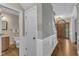 Inviting foyer with hardwood floors, staircase and half bathroom featuring modern fixtures at 4620 Gomar Ln, Fuquay Varina, NC 27526