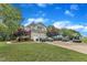 Attached garage with ample parking and tasteful landscaping, providing convenient and attractive home access at 4620 Gomar Ln, Fuquay Varina, NC 27526