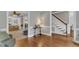 Hallway open to living room and foyer, featuring hardwood floors and traditional finishes at 4620 Gomar Ln, Fuquay Varina, NC 27526