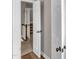 Hallway with light hardwood floors leading to carpeted stairs with wooden banister at 4620 Gomar Ln, Fuquay Varina, NC 27526