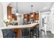 Kitchen with breakfast bar, stainless steel appliances, and ample cabinet space at 4620 Gomar Ln, Fuquay Varina, NC 27526