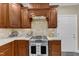 Classic kitchen with stainless steel range, wooden cabinets, and white countertops at 4620 Gomar Ln, Fuquay Varina, NC 27526