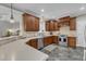 This charming kitchen boasts wooden cabinets, modern appliances, and ample countertop space at 4620 Gomar Ln, Fuquay Varina, NC 27526