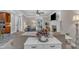 Cozy living room featuring fireplace, ceiling fan, and seamless flow to adjacent living spaces at 4620 Gomar Ln, Fuquay Varina, NC 27526