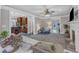 Comfortable living room with open layout, fireplace, ceiling fan and seamless access to the kitchen at 4620 Gomar Ln, Fuquay Varina, NC 27526