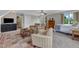 Bright living room featuring sitting area, television, and bed offering an inviting space to relax at 4620 Gomar Ln, Fuquay Varina, NC 27526