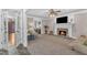 Spacious living room with fireplace, open floor plan, and lots of natural light at 4620 Gomar Ln, Fuquay Varina, NC 27526