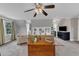 Inviting living room featuring comfortable seating, built in shelves, and a TV for entertainment at 4620 Gomar Ln, Fuquay Varina, NC 27526