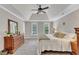 Main bedroom with a tray ceiling, carpet flooring, and natural light at 4620 Gomar Ln, Fuquay Varina, NC 27526