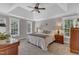 Main bedroom with tray ceilings, and plenty of natural light from the windows at 4620 Gomar Ln, Fuquay Varina, NC 27526