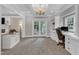Home office featuring custom built-ins, large window for natural light and glass paneled french doors at 4620 Gomar Ln, Fuquay Varina, NC 27526
