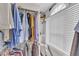 Organized walk-in closet featuring rods for hanging clothes and shelved storage space with a window letting in plenty of light at 4620 Gomar Ln, Fuquay Varina, NC 27526