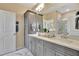 Bathroom boasts double sinks, modern cabinets, vanity mirror, and a glass-enclosed shower at 5028 Jowetts Walk Dr # 24, Cary, NC 27519