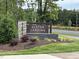 Alston Landing entrance sign surrounded by lush landscaping and manicured grounds at 5028 Jowetts Walk Dr # 24, Cary, NC 27519
