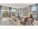 Inviting living room with plush seating, stylish decor, and ample natural light from the sliding glass doors and windows at 5028 Jowetts Walk Dr # 24, Cary, NC 27519