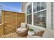 Cozy patio with stylish wicker furniture, a privacy screen, and an inviting outdoor space for relaxation and entertaining at 5028 Jowetts Walk Dr # 24, Cary, NC 27519