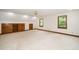 Spacious bedroom features custom built-ins, neutral carpet, ceiling fan, and light-filled windows at 5800 Heatherbrook Cir, Raleigh, NC 27612