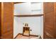 Closet with bi-fold doors has wood shelving and a laundry hook-up at 5800 Heatherbrook Cir, Raleigh, NC 27612