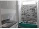 Bathroom features a tub, a vanity sink, and a window at 5900 Tranquil Cv, Youngsville, NC 27596