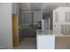 Spacious kitchen featuring grey cabinetry and center island under construction at 5900 Tranquil Cv, Youngsville, NC 27596