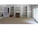 Spacious living room with fireplace and custom built-ins awaits personal touches at 5900 Tranquil Cv, Youngsville, NC 27596