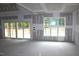 Bright living room featuring a sliding glass door and a large window at 5900 Tranquil Cv, Youngsville, NC 27596