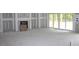 Spacious living room featuring sliding glass door and a cozy fireplace at 5900 Tranquil Cv, Youngsville, NC 27596