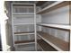 New construction, walk-in pantry with shelving ready for organizing supplies at 5900 Tranquil Cv, Youngsville, NC 27596