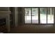 Living room slider door providing easy access to a bright and airy outdoor patio at 5900 Tranquil Cv, Youngsville, NC 27596