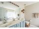 This bathroom has double sinks, large mirror, bathtub, walk-in shower, and tile floor at 6 Newgate Ct, Durham, NC 27713