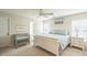 Bright bedroom features a white ceiling fan, large windows and a crib in the corner at 6 Newgate Ct, Durham, NC 27713