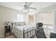 Well-lit bedroom featuring balcony access and a black metal bed frame with a comfortable mattress at 6 Newgate Ct, Durham, NC 27713