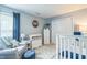 Charming Bedroom with a soft color palette, comfortable seating, and a full-size crib at 6 Newgate Ct, Durham, NC 27713